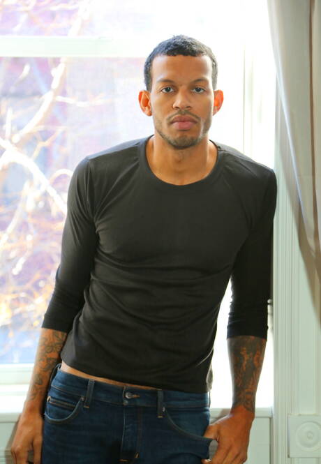 Black well-built Mike Mann shows a perfect body