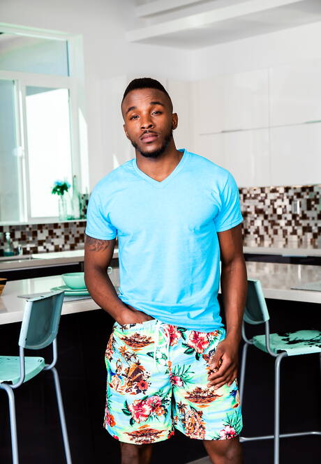 American pornstars strongman Wesley Woods and stud Pheonix Fellington in interracial cock sucking scene in the kitchen