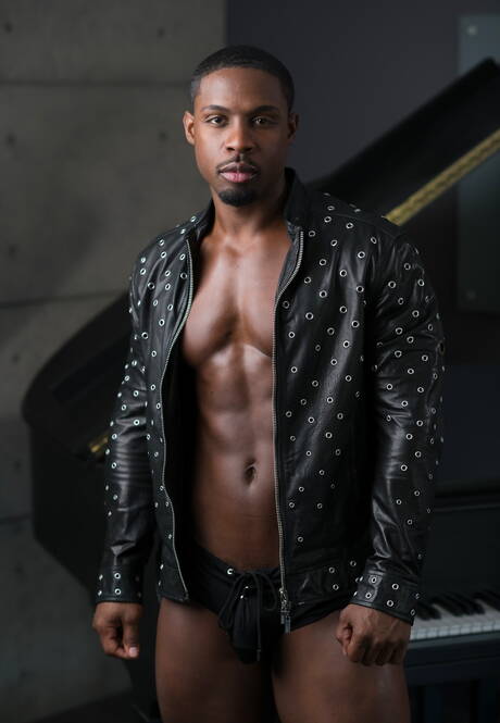 Ebony well-built Deangelo Jackson shows a husky body