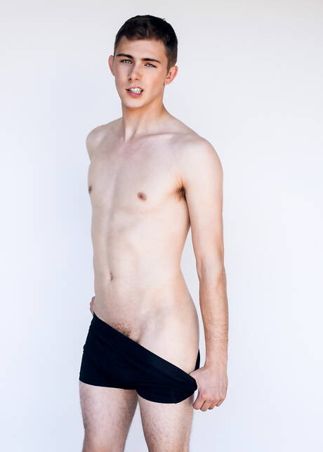 Two american guys young Andy Taylor and young Kody Knight in dick sucking scene on the beach