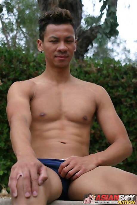 Asian superstud Robbie Trinh teasing his dick outside